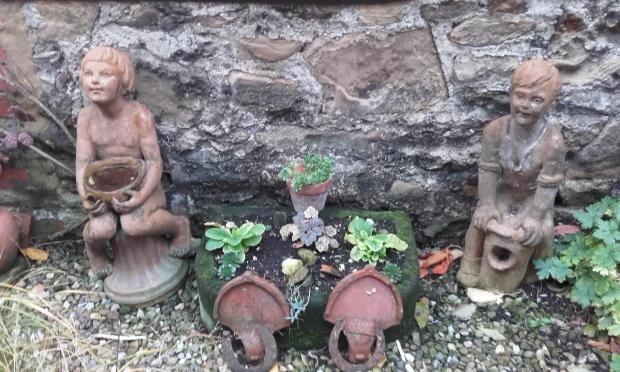 Darlington and Stockton Times: Crossley garden statues, made between 1927 and 1947 in Commondale. Designed by Walter Scott, they were inspired by the brickworks' owner's two children, John and Patricia Crossley, and they now belong to John's daughter, Jo